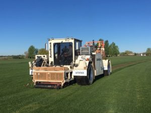 The heavy machine used to harvest the sod.